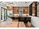 Eat-in kitchen featuring a modern design, bar seating, and stainless steel refrigerator at 321 W Hanlon St, Tampa, FL 33604