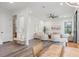 Open-concept living room with ample seating, wood floors, and stylish décor at 321 W Hanlon St, Tampa, FL 33604