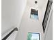Bright stairwell with modern chandelier and natural light from the windows at 321 W Hanlon St, Tampa, FL 33604