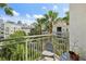 A balcony with a chair and view of the city skyline at 450 Knights Run Ave # 411, Tampa, FL 33602
