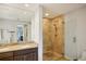 Elegant bathroom with a double vanity and large walk-in shower at 450 Knights Run Ave # 411, Tampa, FL 33602