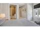 Serene bedroom with a view, striped bedding and an attached bathroom at 450 Knights Run Ave # 411, Tampa, FL 33602