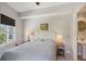 Bright bedroom with a comfortable bed, ample natural light, and en-suite bathroom at 450 Knights Run Ave # 411, Tampa, FL 33602