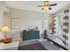 Bright bedroom with a dresser, armchair, and access to a balcony at 450 Knights Run Ave # 411, Tampa, FL 33602