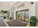 The Plaza Harbour Island building entrance with automatic doors and landscaping at 450 Knights Run Ave # 411, Tampa, FL 33602