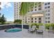 Relaxing hot tub with pergola and lounge chairs at 450 Knights Run Ave # 411, Tampa, FL 33602