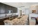Spacious kitchen boasting granite countertops and dark wood cabinetry at 450 Knights Run Ave # 411, Tampa, FL 33602