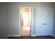 Bedroom featuring light-colored walls, hardwood floors, closet space, and access to the bathroom at 759 48Th N Ave, St Petersburg, FL 33703
