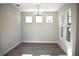 Bright dining room featuring hardwood floors, ample natural light, and contemporary chandelier at 759 48Th N Ave, St Petersburg, FL 33703