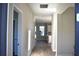 Inviting entryway featuring light hardwood floors, neutral walls, and views into the kitchen at 759 48Th N Ave, St Petersburg, FL 33703