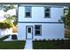 Back of the home showing two stories with windows and a small yard at 759 48Th N Ave, St Petersburg, FL 33703