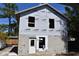 Exterior of home under construction, showing exposed framework, a front door, and window openings at 759 48Th N Ave, St Petersburg, FL 33703
