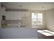Modern kitchen featuring white cabinetry, hardwood floors, and a center island with a sink at 759 48Th N Ave, St Petersburg, FL 33703