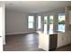 Modern kitchen featuring white cabinetry, stainless steel appliances, hardwood floors, and a center island at 759 48Th N Ave, St Petersburg, FL 33703