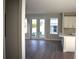 Open-concept living room area featuring hardwood floors, natural light, and backyard access at 759 48Th N Ave, St Petersburg, FL 33703