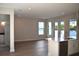 Open-concept living room with hardwood floors, backyard access, and a view of the kitchen at 759 48Th N Ave, St Petersburg, FL 33703