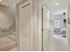 Carpeted staircase and hallway with doors to bedrooms at 450 Knights Run Ave # 411, Tampa, FL 33602