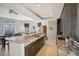 Modern kitchen with granite countertops and dark cabinetry at 450 Knights Run Ave # 411, Tampa, FL 33602