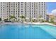 Resort-style pool with surrounding lounge chairs at 450 Knights Run Ave # 411, Tampa, FL 33602