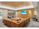 Community lounge with large sectional sofa and flatscreen TV at 450 Knights Run Ave # 411, Tampa, FL 33602