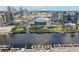 Aerial view of property near the waterfront with a view of the city skyline and stadium at 450 Knights Run Ave # 411, Tampa, FL 33602