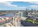 Aerial view highlighting the property's proximity to the city's skyline and the river at 450 Knights Run Ave # 411, Tampa, FL 33602