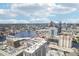Aerial view highlighting the property's prime location near the vibrant city skyline and river at 450 Knights Run Ave # 411, Tampa, FL 33602
