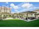 Outdoor patio with pergola, grill, and comfortable seating areas at 450 Knights Run Ave # 411, Tampa, FL 33602