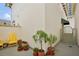 Small patio with yellow chairs and potted plants at 450 Knights Run Ave # 411, Tampa, FL 33602