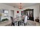 Elegant dining room featuring a dark wood cabinet and glass dining table at 2410 N Boulevard, Tampa, FL 33602