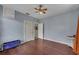 Simple bedroom with wood floors, ceiling fan, and neutral walls at 2410 N Boulevard, Tampa, FL 33602