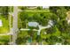 Aerial view of a house with a large yard, pool, and detached garage at 13803 E 92 Hwy, Dover, FL 33527