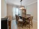 Dining room with a large wooden table and chandelier at 11432 Drifting Leaf Dr, Riverview, FL 33579