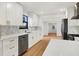 Modern kitchen featuring white cabinets, quartz counters, and stainless steel appliances at 4649 18Th N Ave, St Petersburg, FL 33713