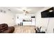 Living room with a kitchenette and hardwood floors at 2503 W Marquette Ave, Tampa, FL 33614