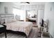 Bright bedroom featuring a queen-size bed and mirrored closet doors at 2503 W Marquette Ave, Tampa, FL 33614