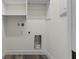 Laundry room with shelving and built-in cabinets at 321 W Hanlon St, Tampa, FL 33604