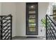 Modern front door with glass panels and black metal accents at 321 W Hanlon St, Tampa, FL 33604