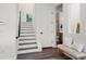 Modern staircase with dark wood steps and a white wall at 321 W Hanlon St, Tampa, FL 33604