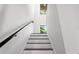 Modern staircase with dark wood steps and a sleek metal railing at 321 W Hanlon St, Tampa, FL 33604
