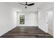 Bright bedroom with wood-look floors and large window at 321 W Hanlon St, Tampa, FL 33604