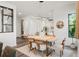 Open concept dining area with modern light fixture and wood dining table at 321 W Hanlon St, Tampa, FL 33604
