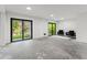 Versatile basement space with sliding doors that lead to the backyard at 321 W Hanlon St, Tampa, FL 33604