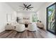 Spacious living room with light walls, neutral furniture and hardwood floors at 321 W Hanlon St, Tampa, FL 33604