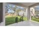 Relaxing covered porch view of a green backyard, perfect for outdoor enjoyment at 2206 N Boulevard, Tampa, FL 33602