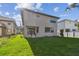 Lush green backyard of modern home showcasing fresh lawn and stylish design at 2206 N Boulevard, Tampa, FL 33602