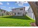 Well-kept backyard with lush lawn and modern architectural home exterior at 2206 N Boulevard, Tampa, FL 33602
