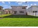 Beautifully maintained backyard featuring a lush lawn and modern exterior at 2206 N Boulevard, Tampa, FL 33602