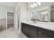Modern bathroom featuring dual vanity, large mirror and tile flooring at 2206 N Boulevard, Tampa, FL 33602