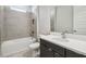 Modern bathroom with sleek vanity, bathtub and grey tile at 2206 N Boulevard, Tampa, FL 33602